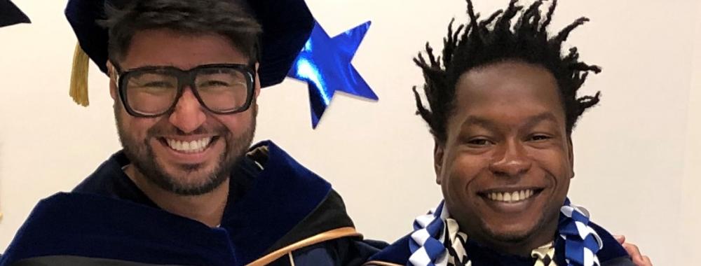 Photograph of two Ph.D. students on graduation day